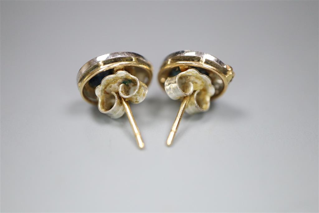 A pair of modern yellow and white metal, sapphire and diamond set oval cluster earrings,